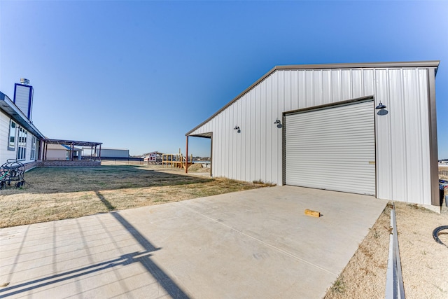 garage with a yard