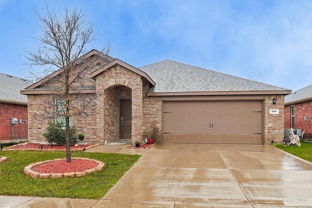 ranch-style home featuring a garage