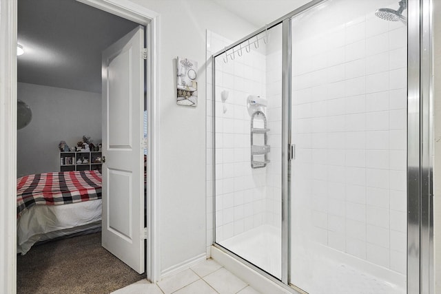 bathroom featuring an enclosed shower and tile patterned floors