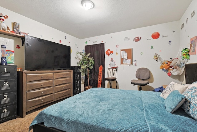 carpeted bedroom featuring a textured ceiling