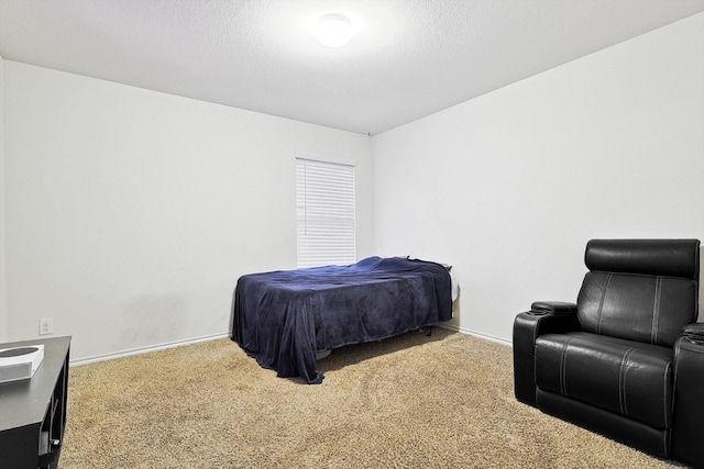 carpeted bedroom featuring a textured ceiling