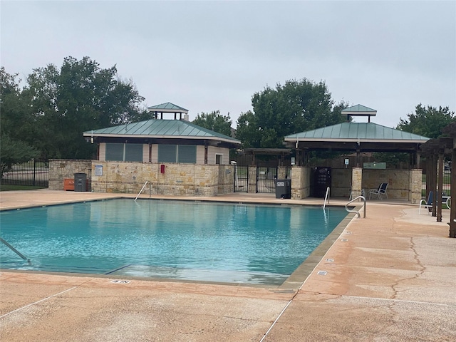 view of swimming pool featuring a gazebo