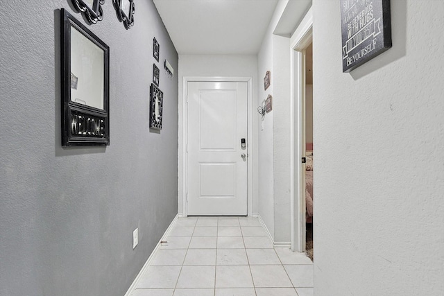 corridor featuring light tile patterned floors