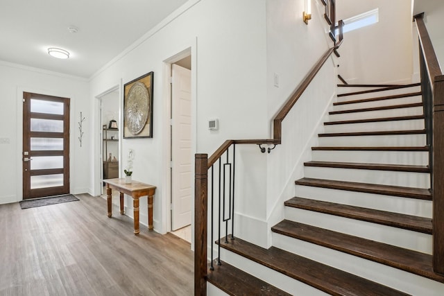 3426 Borger St, Dallas, TX 75212 - entryway with wood finished floors, crown molding, healthy amount of natural light, stairway, and baseboards