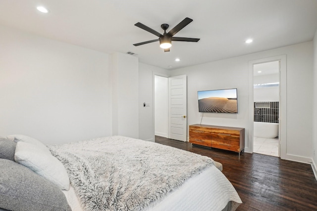 bedroom featuring connected bathroom, dark wood-type flooring, and ceiling fan