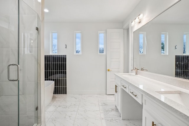 bathroom featuring vanity and separate shower and tub