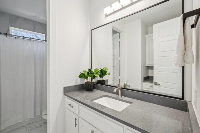 3426 Borger St, Dallas, TX 75212 - bathroom featuring vanity, toilet, marble look tile flooring, and curtained shower
