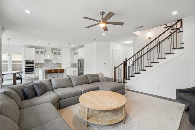 3426 Borger St, Dallas, TX 75212 - living area featuring ceiling fan, stairway, recessed lighting, baseboards, and light wood-type flooring