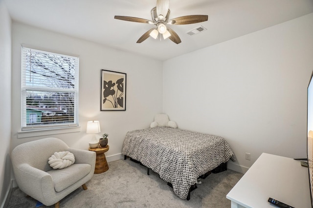 bedroom featuring light colored carpet and ceiling fan