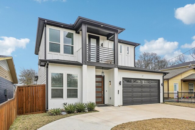 3426 Borger St, Dallas, TX 75212 - contemporary home with a balcony, board and batten siding, driveway, and a garage