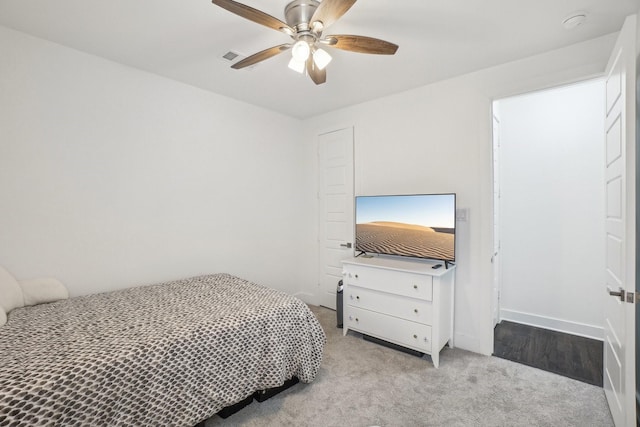 carpeted bedroom with ceiling fan