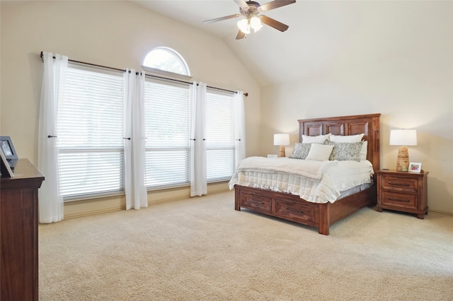 carpeted bedroom with vaulted ceiling and ceiling fan