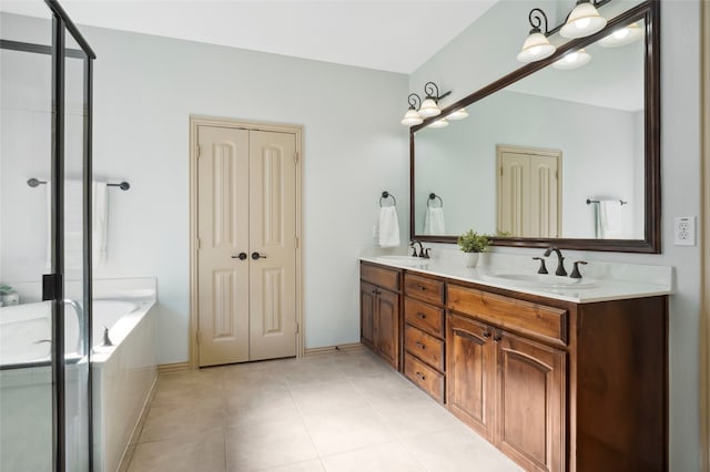 bathroom with tile patterned flooring, vanity, and separate shower and tub