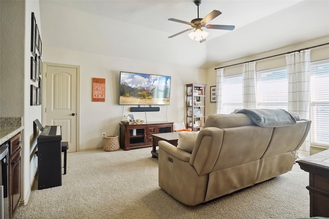 carpeted living room featuring lofted ceiling and ceiling fan