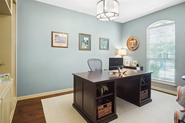 office with light hardwood / wood-style floors