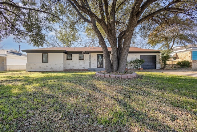 single story home with a garage and a front yard