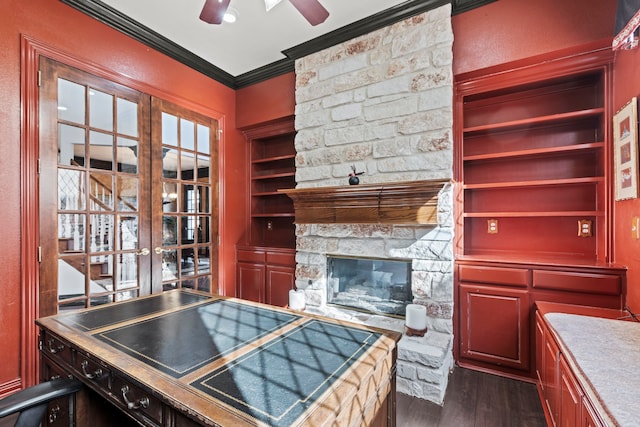 kitchen featuring a fireplace, ceiling fan, crown molding, dark wood-type flooring, and french doors