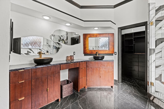 bathroom with ornamental molding and vanity