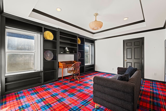 living room with crown molding, built in features, and a tray ceiling