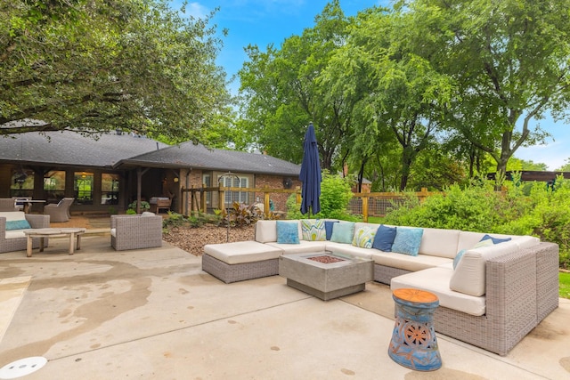 view of patio / terrace featuring an outdoor living space with a fire pit