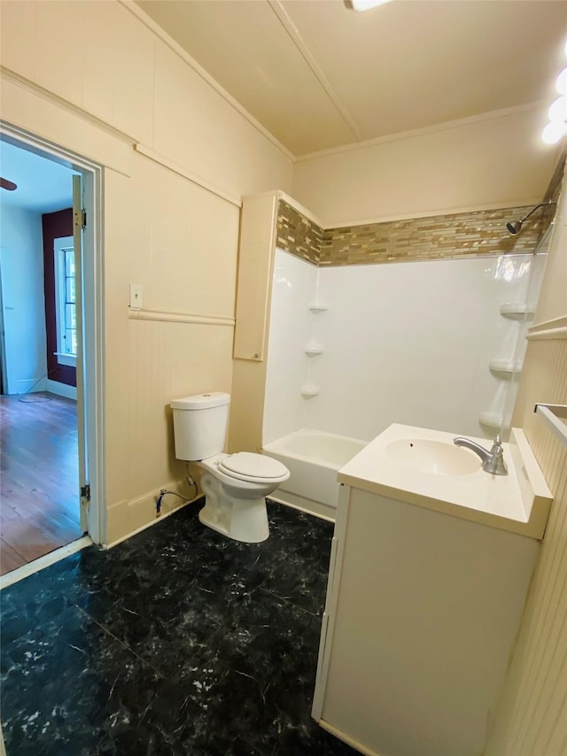 full bathroom featuring ornamental molding, toilet, shower / bathing tub combination, and vanity