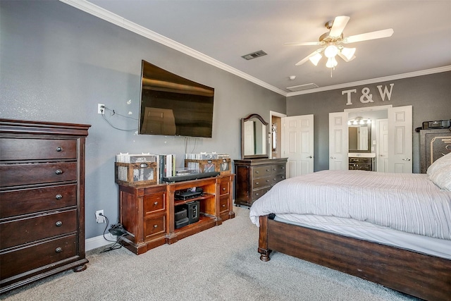 carpeted bedroom with ceiling fan, ornamental molding, and ensuite bath