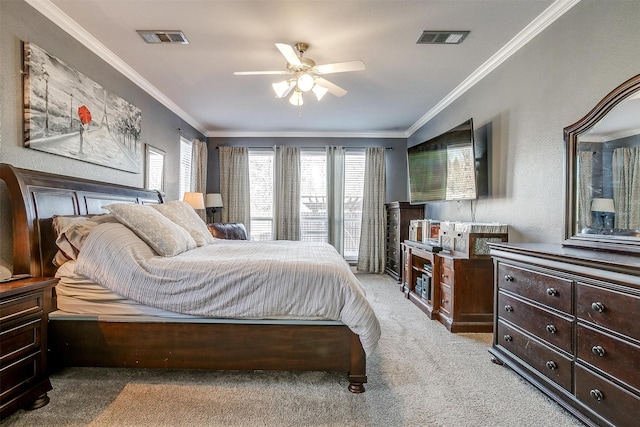 bedroom featuring ornamental molding, light carpet, and ceiling fan