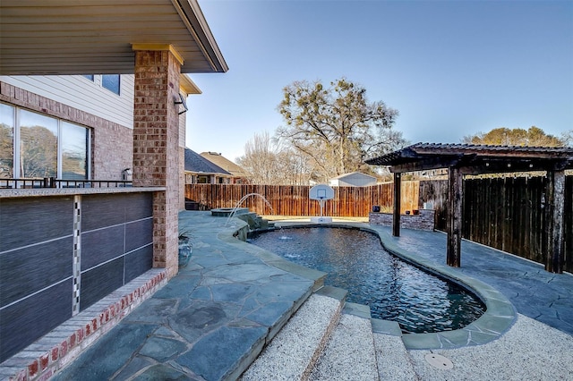 view of pool featuring a patio and pool water feature