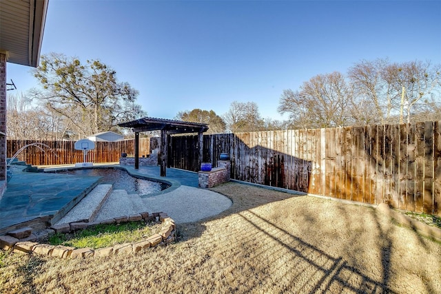 view of yard with a pergola and a covered pool