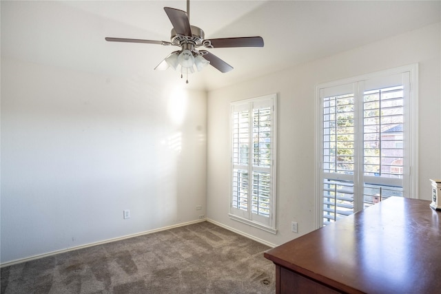 unfurnished office with carpet floors and ceiling fan