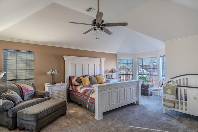 carpeted bedroom featuring crown molding, ceiling fan, and vaulted ceiling