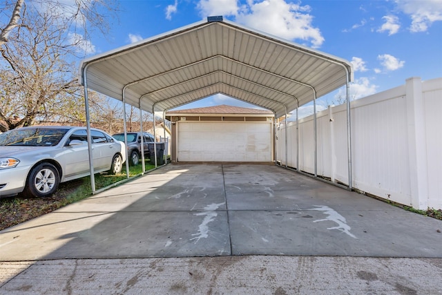 view of car parking with a garage and a carport