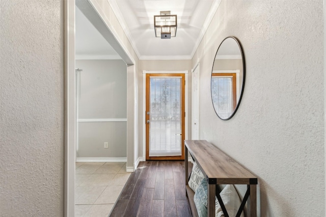 doorway with ornamental molding and hardwood / wood-style floors