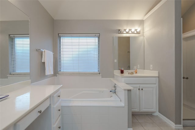 bathroom featuring vanity, a relaxing tiled tub, tile patterned floors, and lofted ceiling