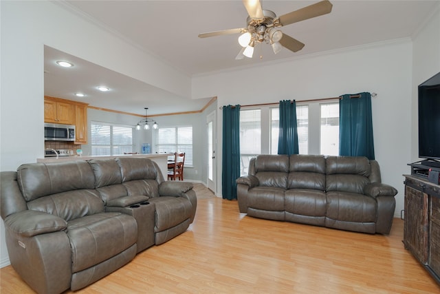 living room with crown molding, ceiling fan, and light hardwood / wood-style flooring