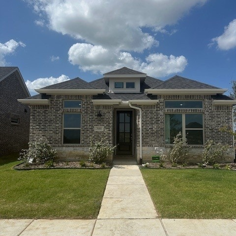 3101 Buckeye St, Celina, TX 75009 - prairie-style house with brick siding, a front yard, and roof with shingles