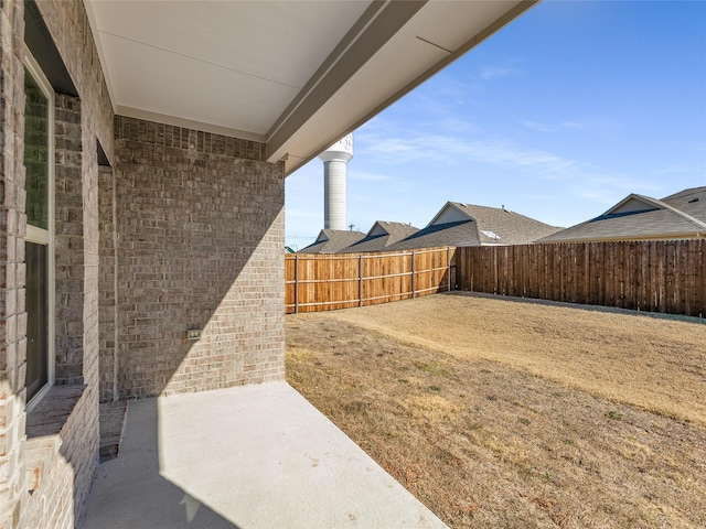 view of yard featuring a fenced backyard and a patio