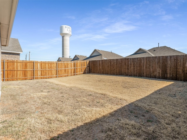 view of yard featuring a fenced backyard