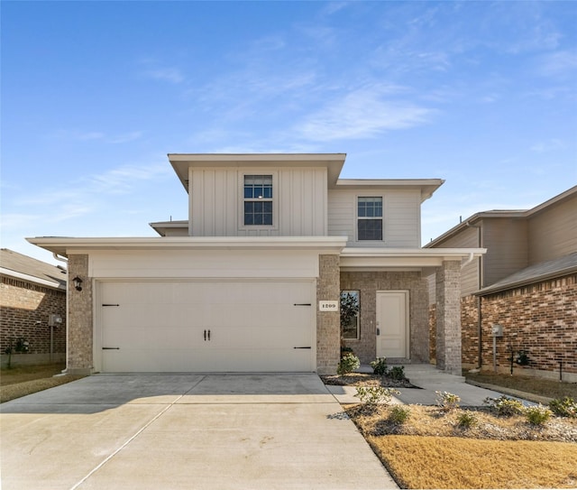 traditional-style house featuring concrete driveway, brick siding, and board and batten siding