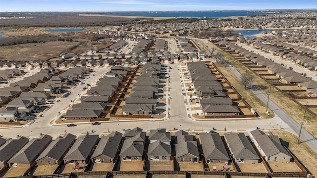 aerial view featuring a water view and a residential view