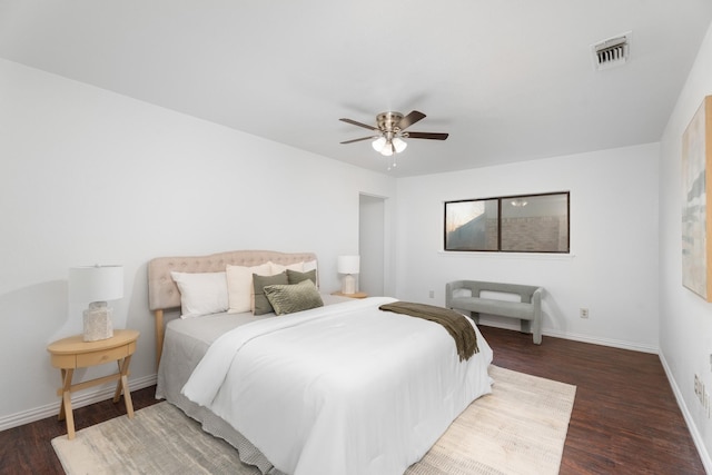 bedroom with ceiling fan and dark hardwood / wood-style flooring