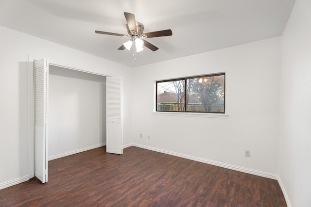 unfurnished bedroom with dark hardwood / wood-style flooring, ceiling fan, and a closet