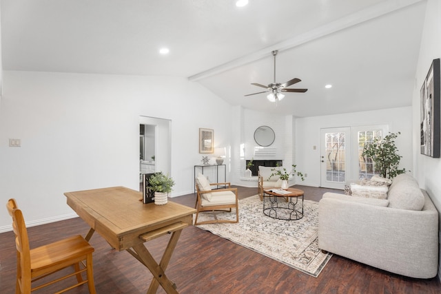 living room featuring ceiling fan, a fireplace, lofted ceiling with beams, and wood-type flooring