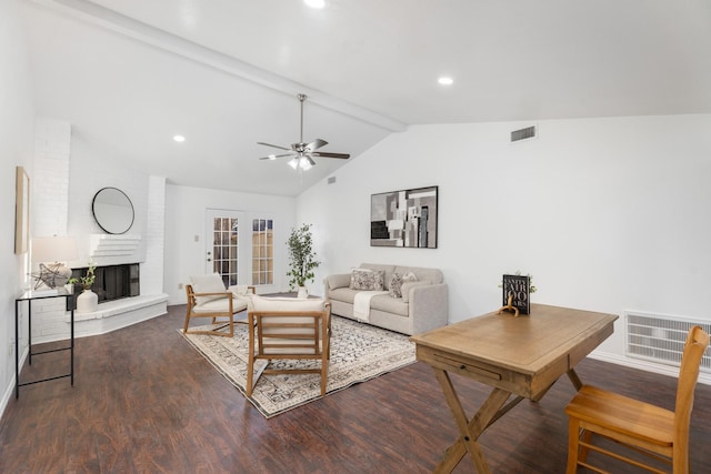 living room featuring ceiling fan, dark hardwood / wood-style floors, a fireplace, lofted ceiling with beams, and french doors