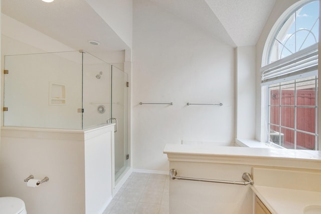 bathroom with lofted ceiling, toilet, a shower with shower door, a textured ceiling, and vanity