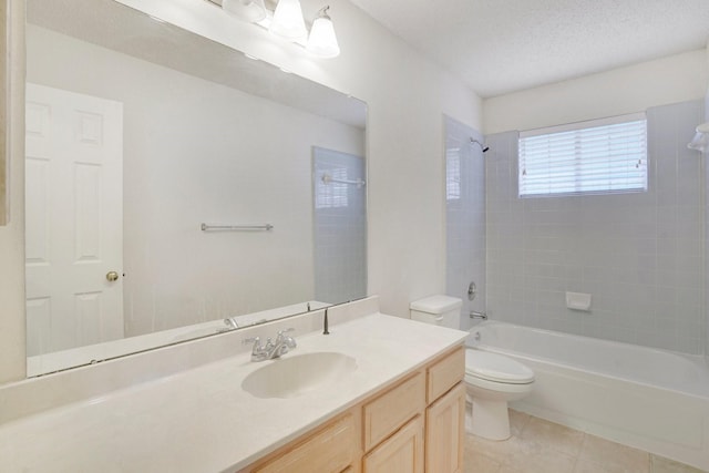 full bathroom featuring tile patterned floors, toilet, a textured ceiling, vanity, and tiled shower / bath combo