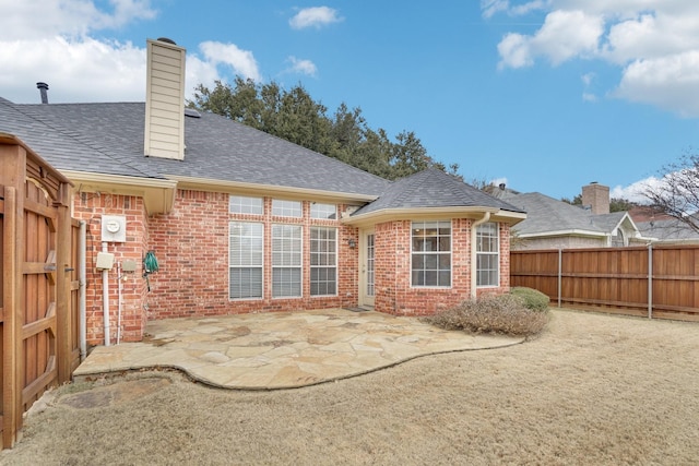 rear view of house with a patio