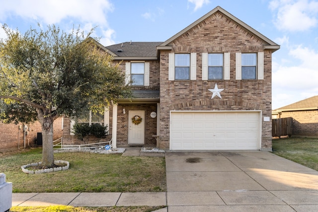 view of front of home with a garage and a front yard