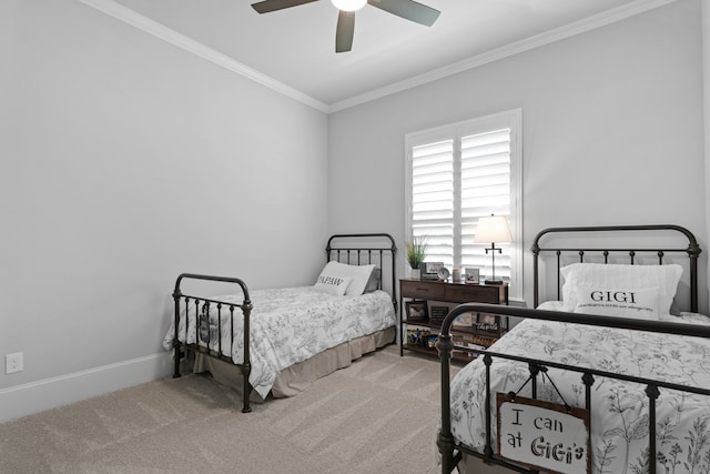 carpeted bedroom with crown molding and ceiling fan