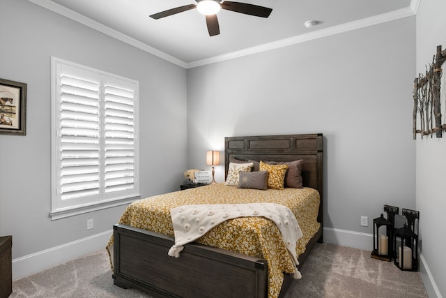 carpeted bedroom with crown molding and ceiling fan